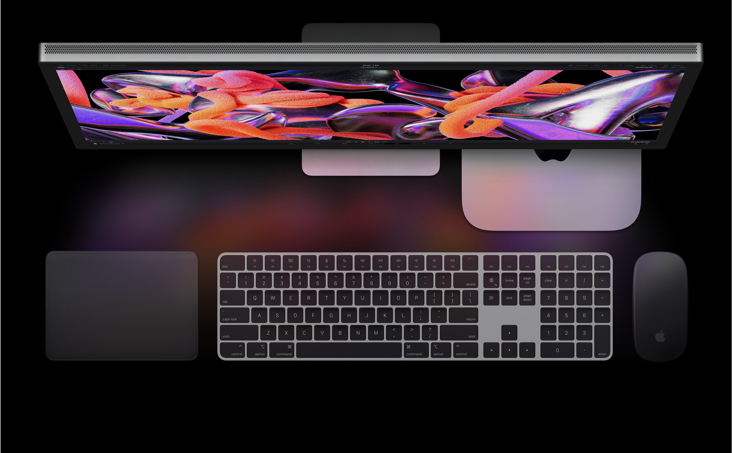 Top view of Studio Display, Mac mini, Magic Trackpad, Magic Keyboard and Magic Mouse.