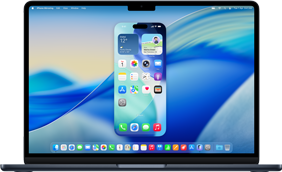 MacBook displaying full iPhone home screen with app icons and status bar icons